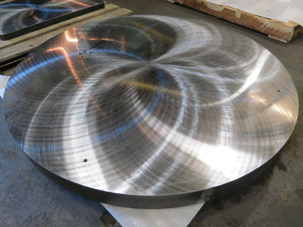 Freshly Blanchard-ground circular steel plate
